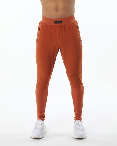 Alphalete Woven 4-Way Stretch 29" Pant Sour Tangerine | NDGETZ130